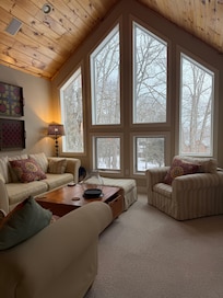 The loft was a charming space with a cabinet full of books