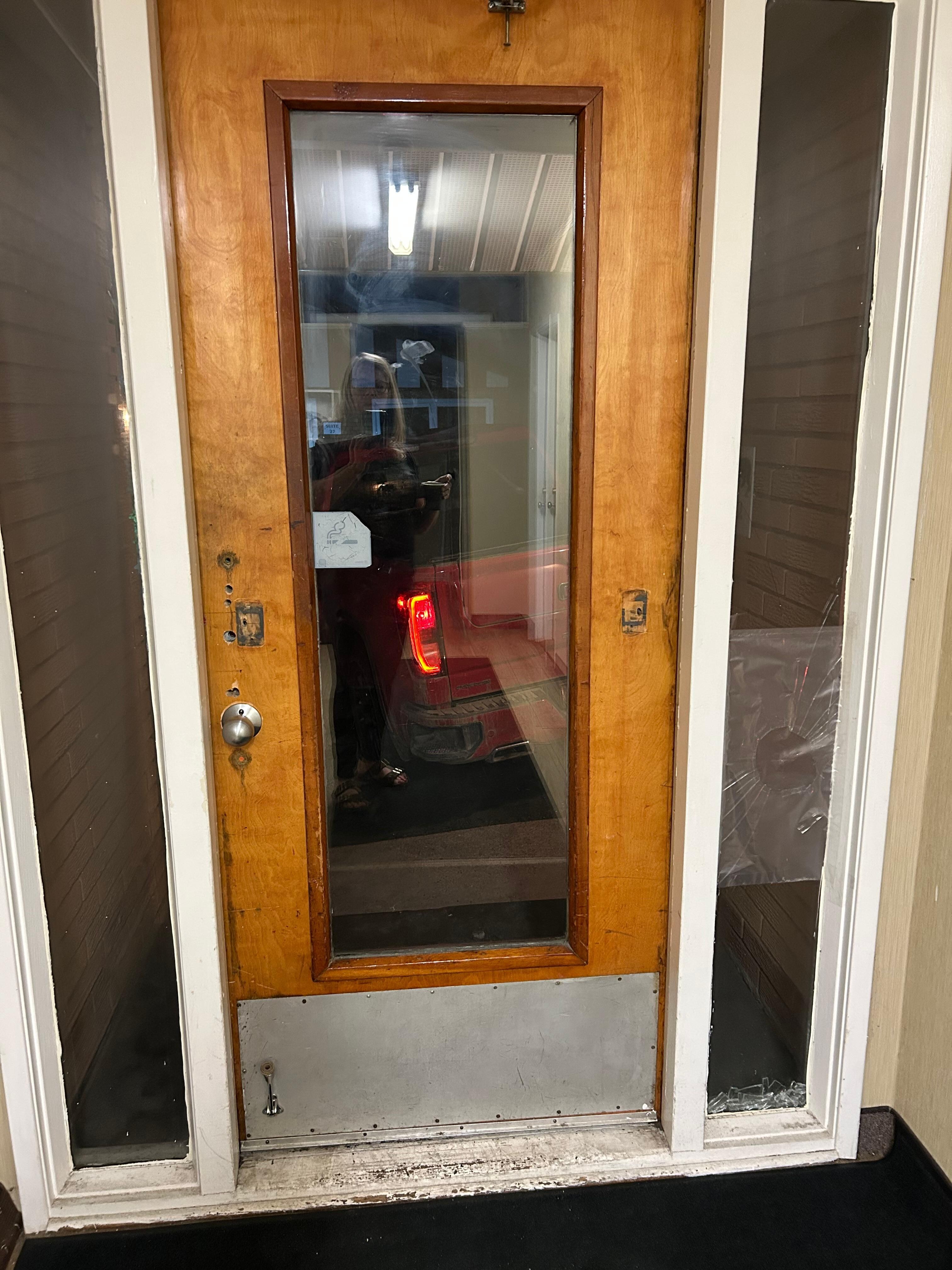 Holes in door and not secure 
