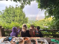 From the lower terrace watching the rainbow during dinner