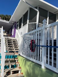 Back stairs going up to our room/screened in porch. There’s another (private) entrance to the room in the front of the house at street level.