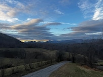 View from deck/porch, main living area, and primary bedroom!