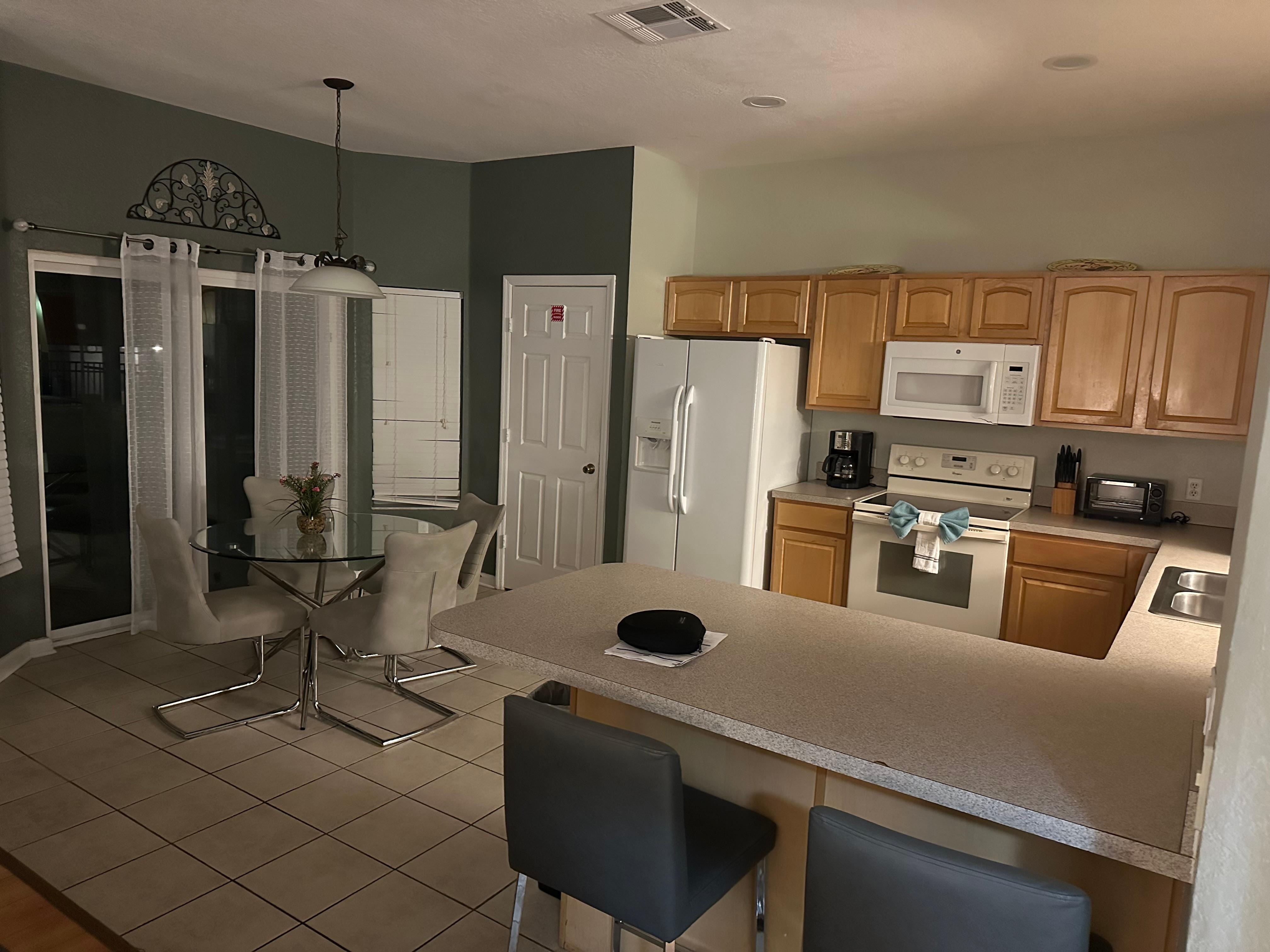 The kitchen cupboards greasey and cracked door on the microwave that was covered in tape after we reported it.