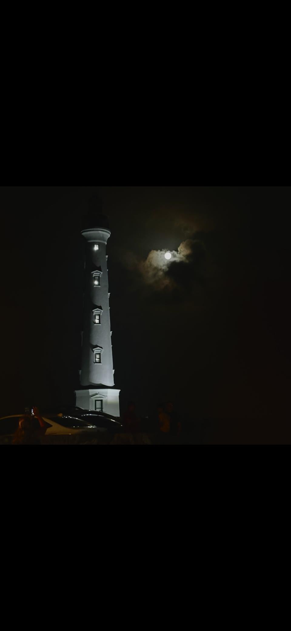 Full moon lighthouse nearby 