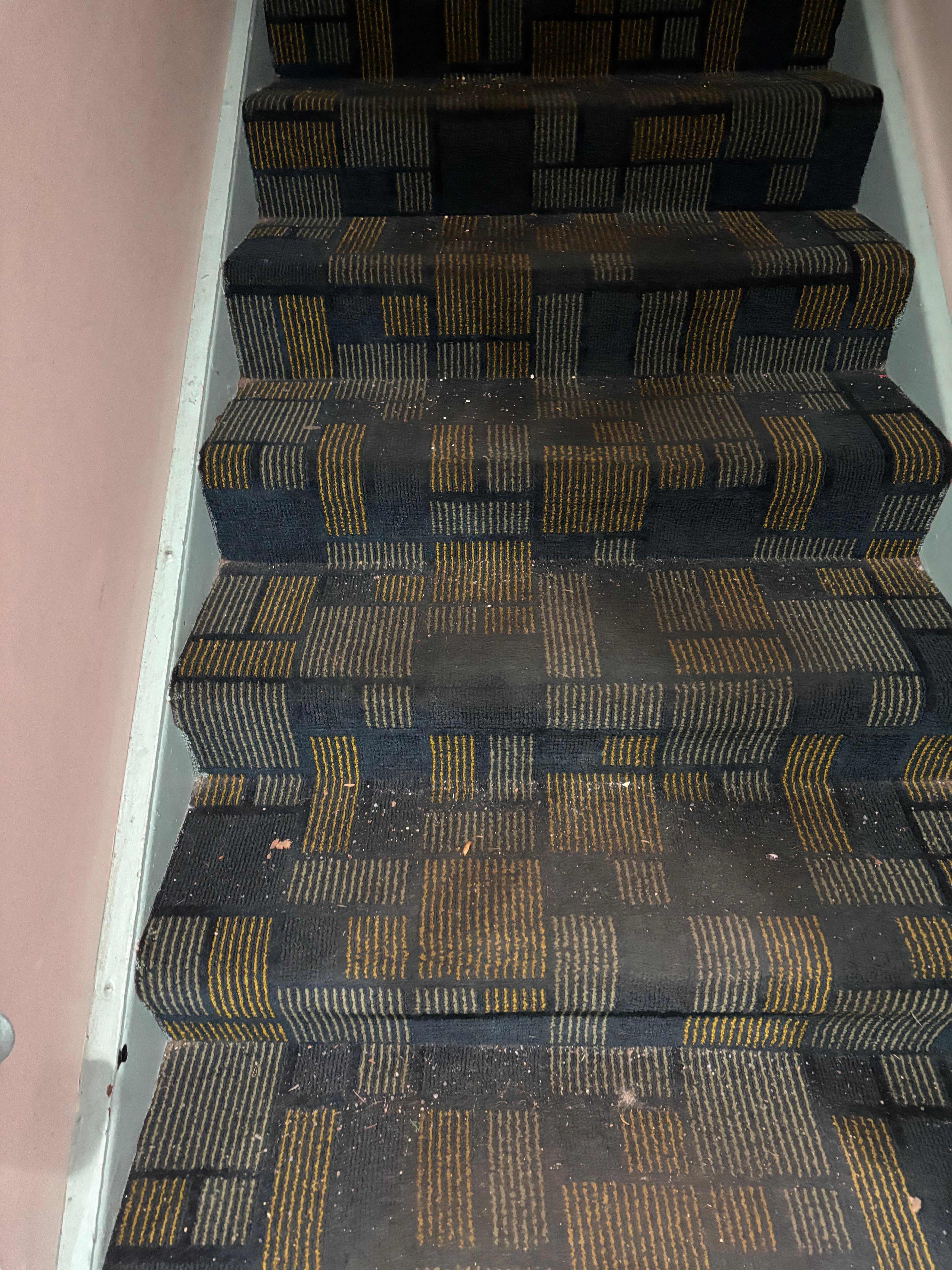 The stairwell going up to our room by the front desk