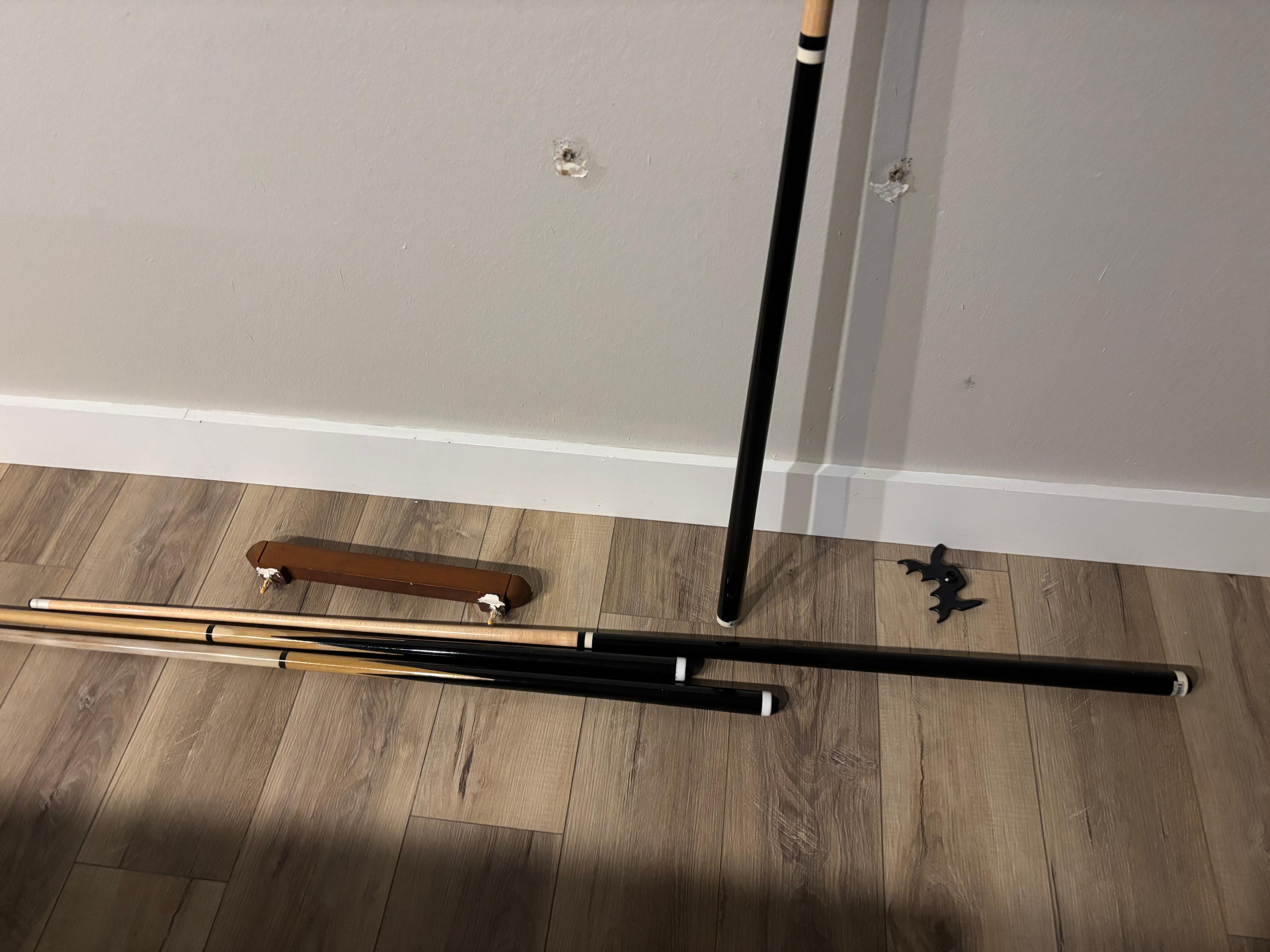Pool cues fell off the wall