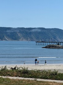 Crescent City beach and showing off the pier we crabbed off of (caught 5 crab for dinner)!