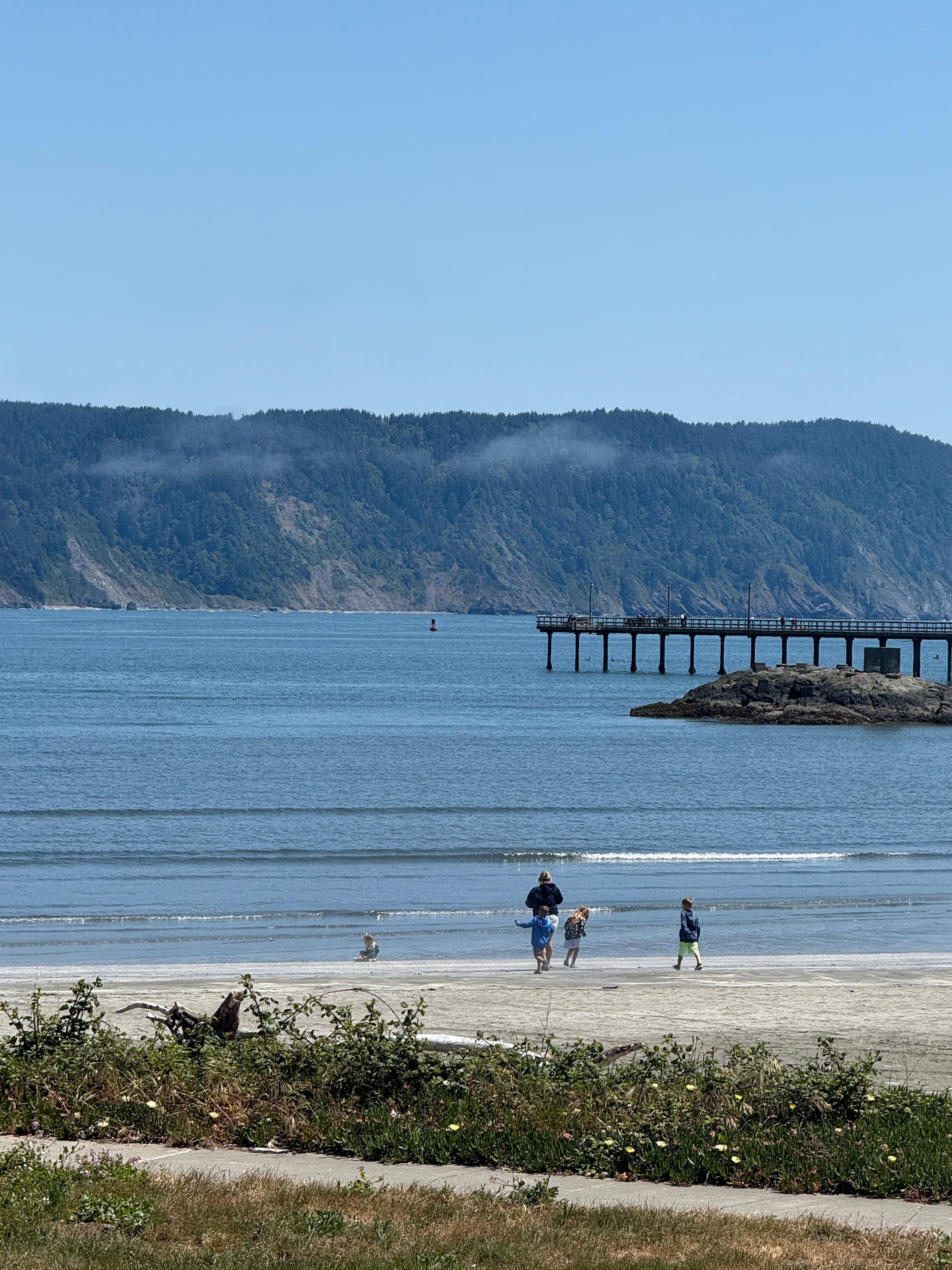 Crescent City beach and showing off the pier we crabbed off of (caught 5 crab for dinner)!