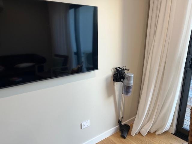 Hanging vacuum next to the TV was the only wall "decoration" in the entire unit. 