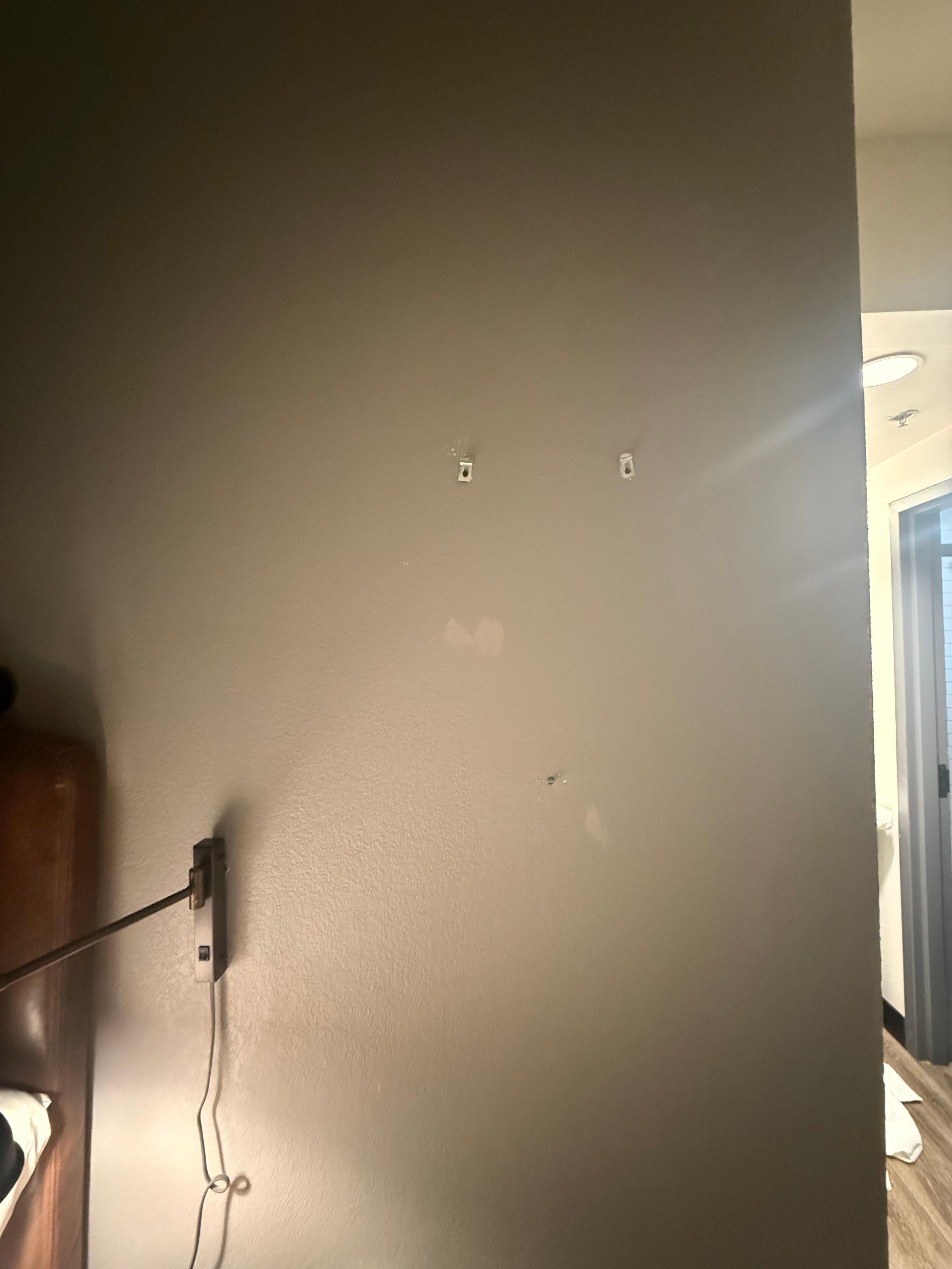 Where there was something on the wall prior to our visit. It was removed but never repaired. 