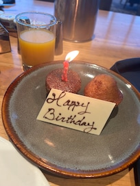 We got the buffet breakfast , since it was my birthday . Our waiter apologized that there wasn't birthday cake at breakfast time ; but then he showed up with the little muffins with a birthday wish and candle ! How charming