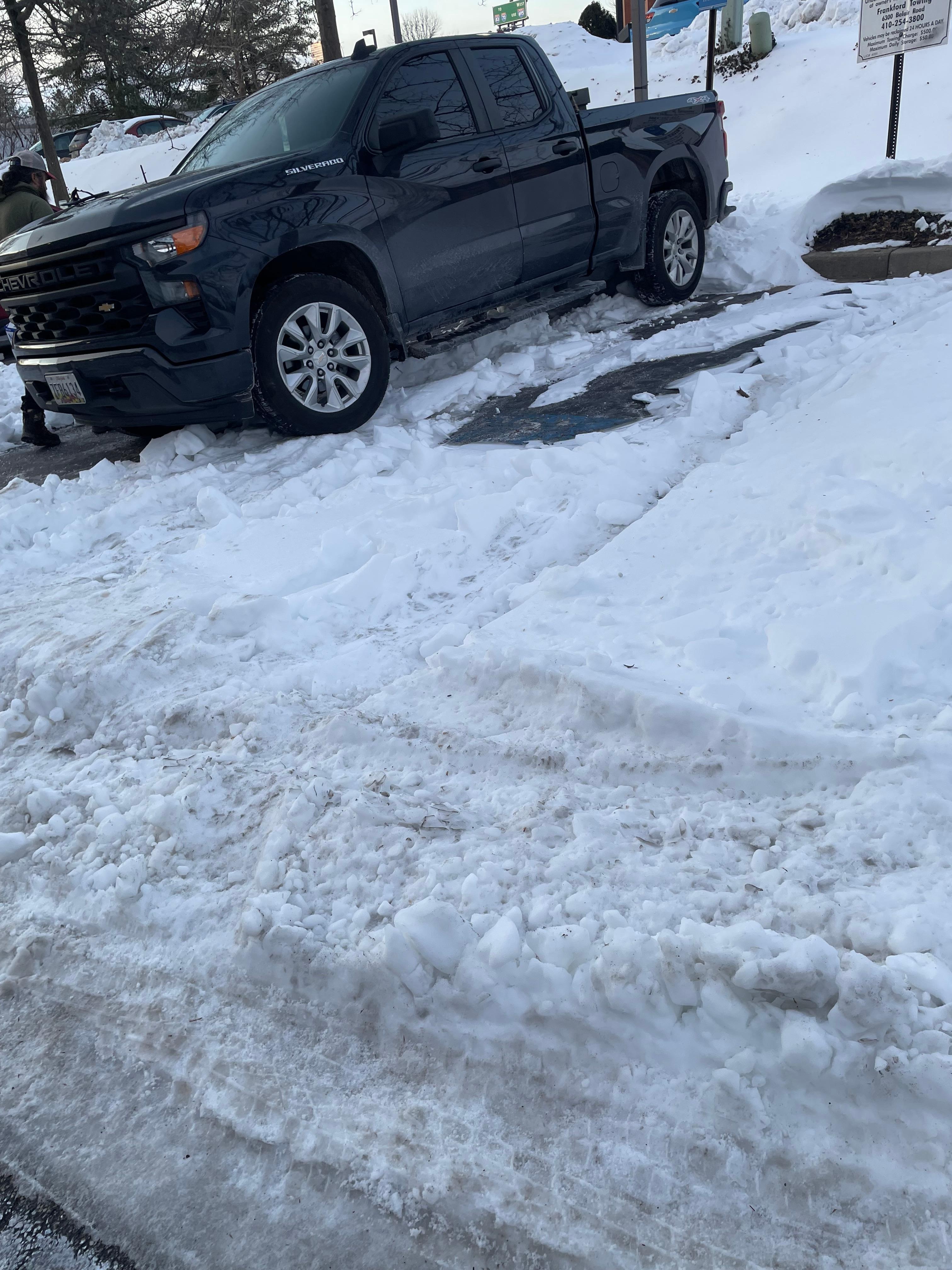How the handicap parking spaces were cleared after snow. How can someone disabled park here? 