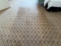 Cut and patched carpet in Presidential Suite