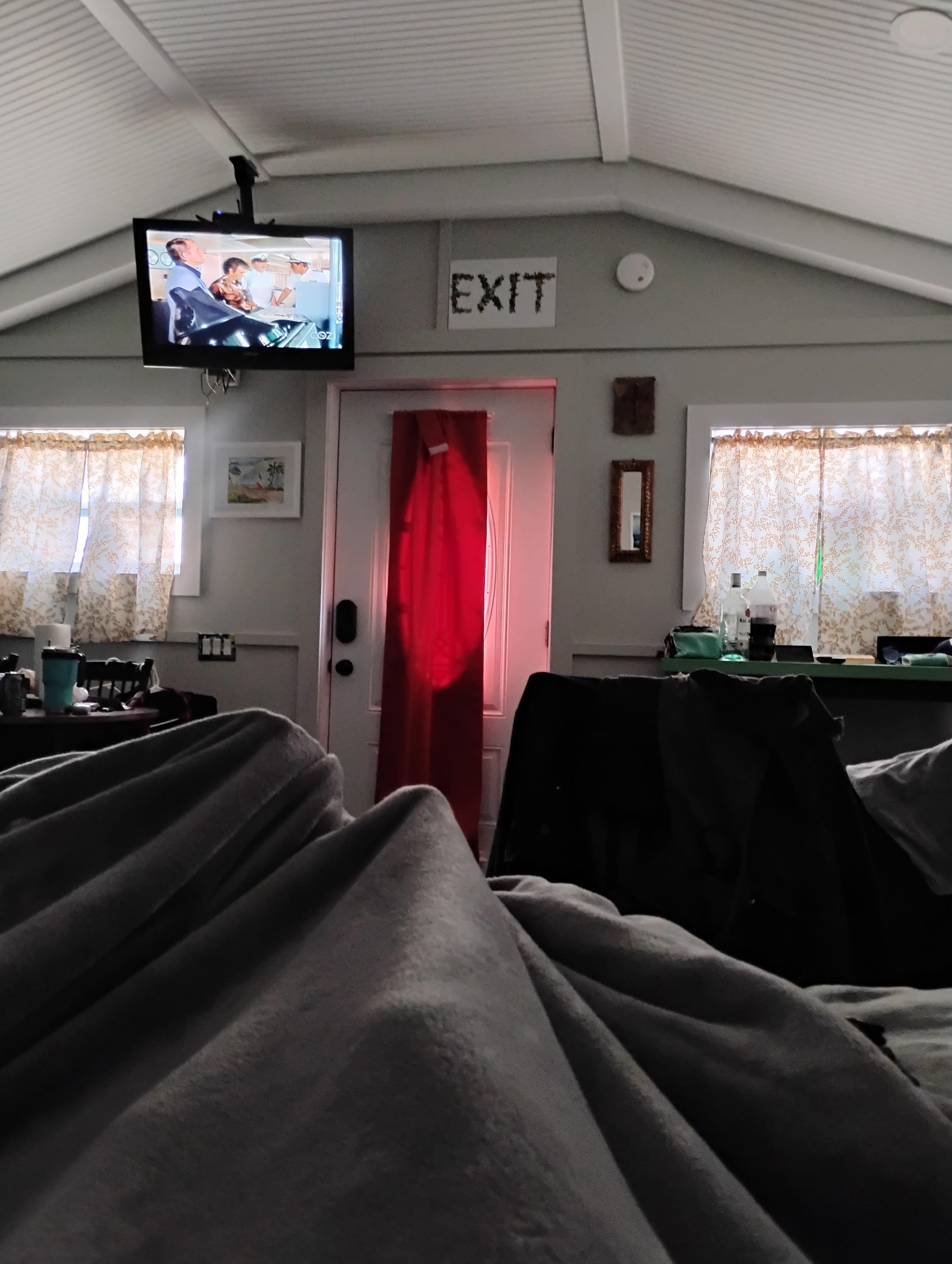 Lying in bed watching TV