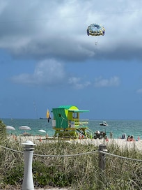 Walk out the building door to direct beach access.