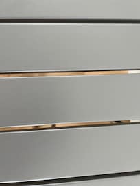 Wide gaps between slats of metal "dining" table meant crumbs and drips went everywhere.