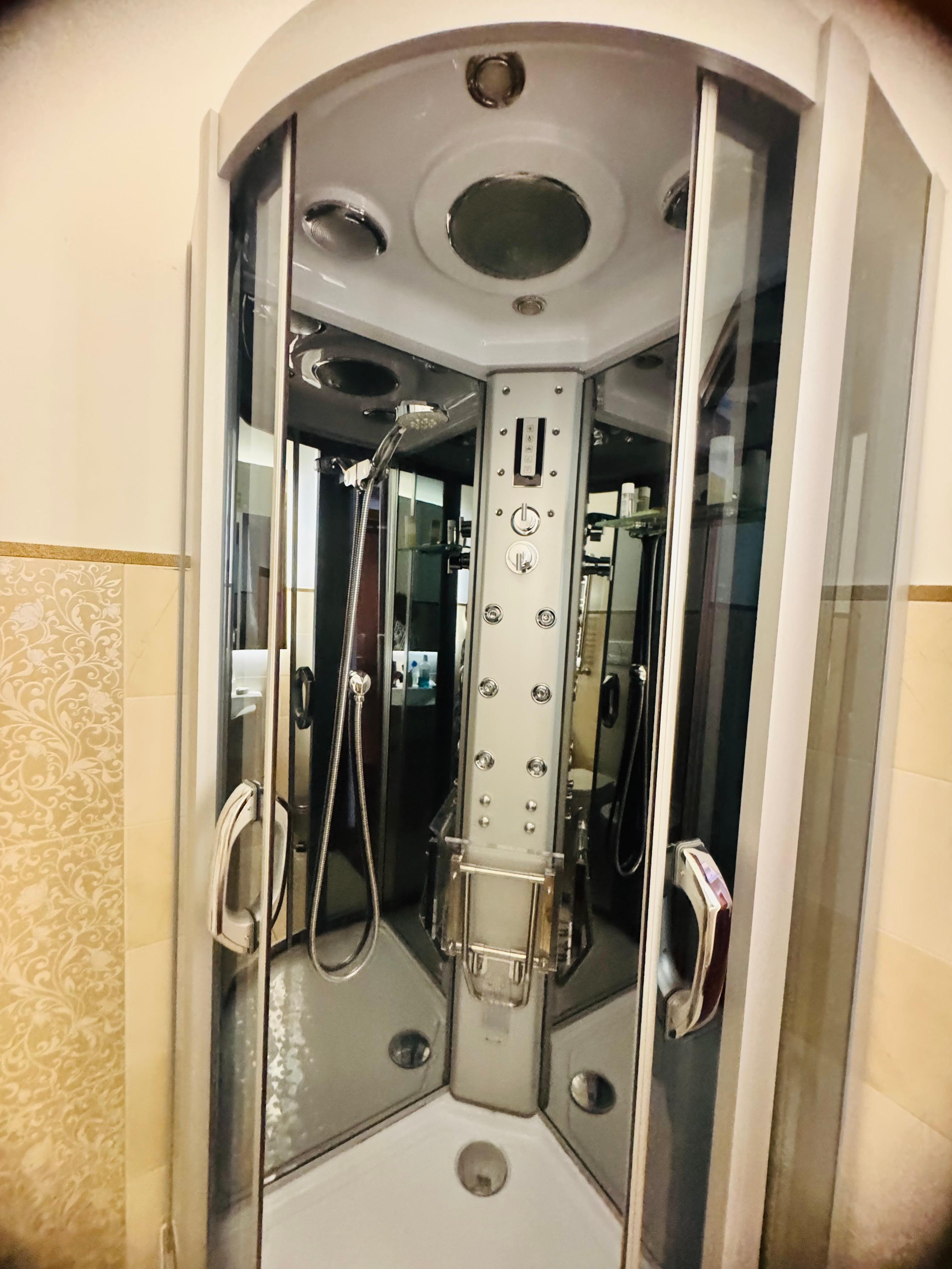 Shower with multi jet outlets, lights, and music