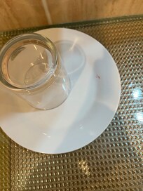 Dirty plate and glasses left in the room.