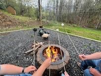 Fire pit, roasting marshmallows.