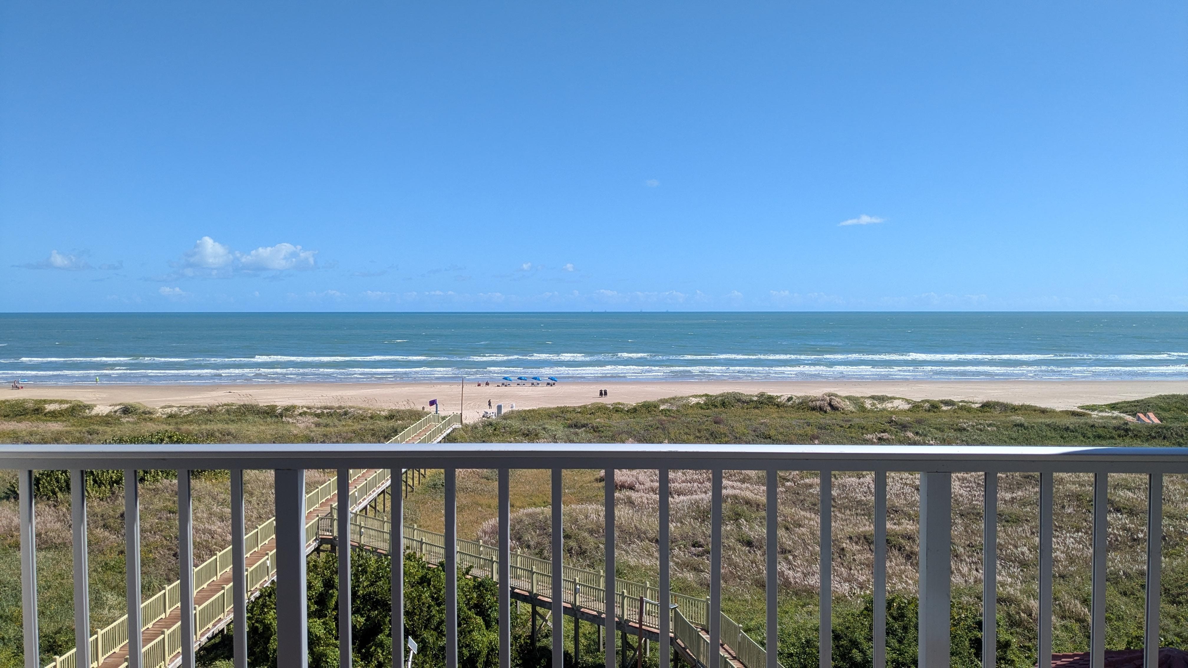 View from our balcony on the 4th floor. The ocean is closer than it appears in the photos