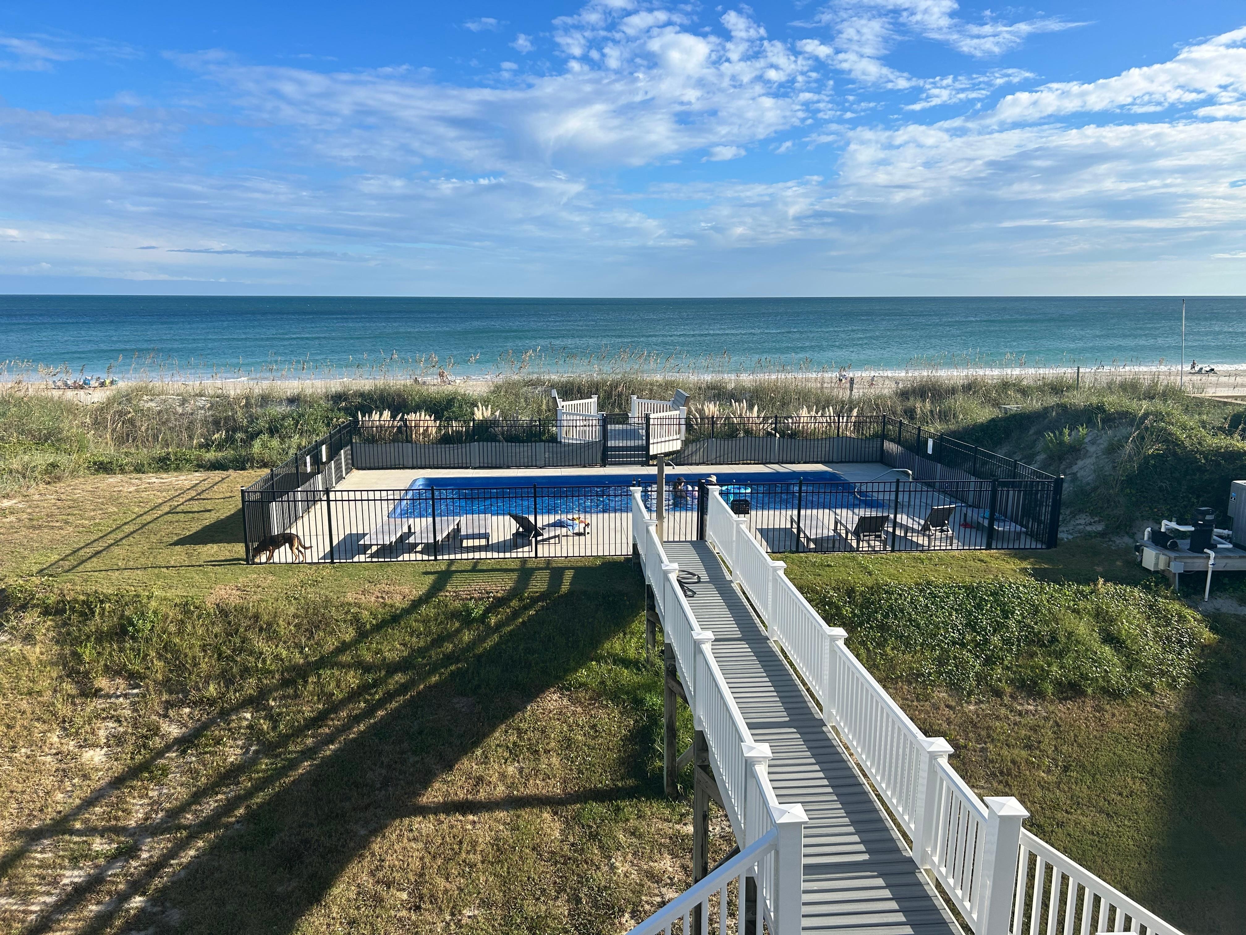 View of the pool and beach from one of the decks