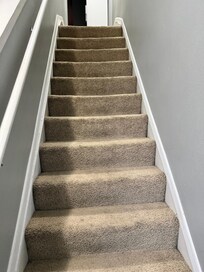 dingy carpet on the stairs