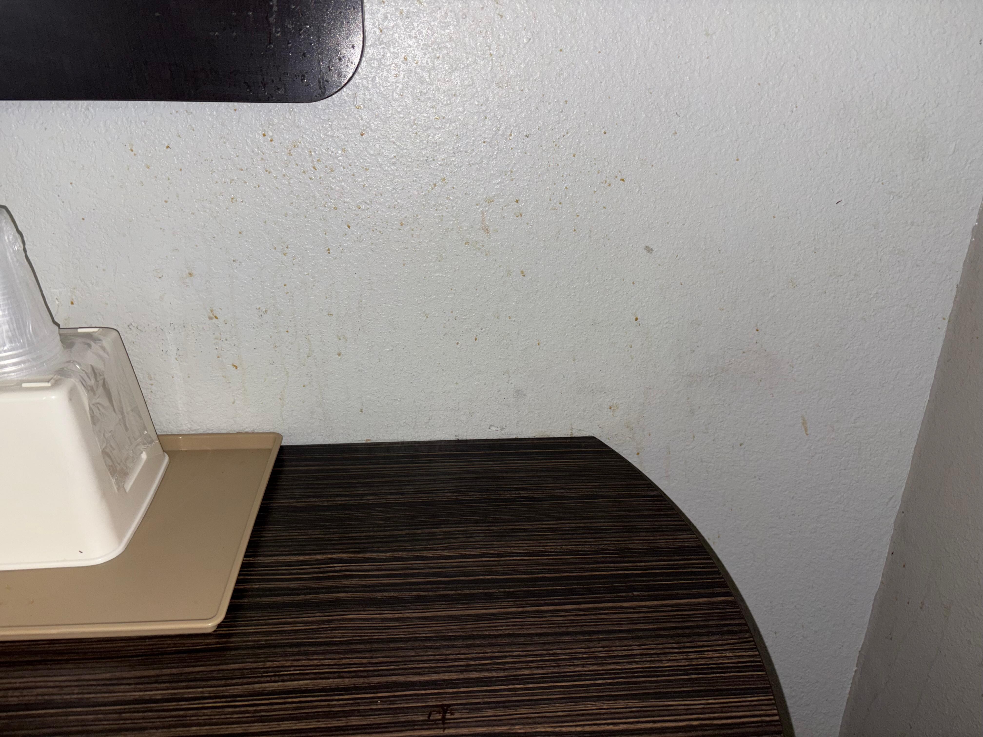 Stains and dirt on the table and wall