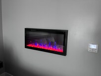 Electric fireplace in room,mostly for looks.