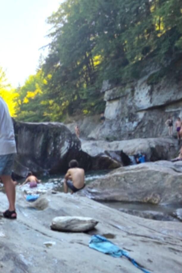 Warren Falls, great deep pool for soaking in the river, rocks for jumping.
Requires sure footing to walk across stream to get to sitting rocks