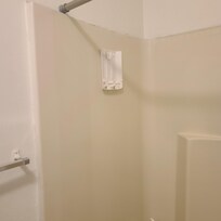 Soap dispenser in shower is missing pieces and broken