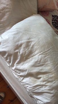 Dirty pillows with no pillow case on