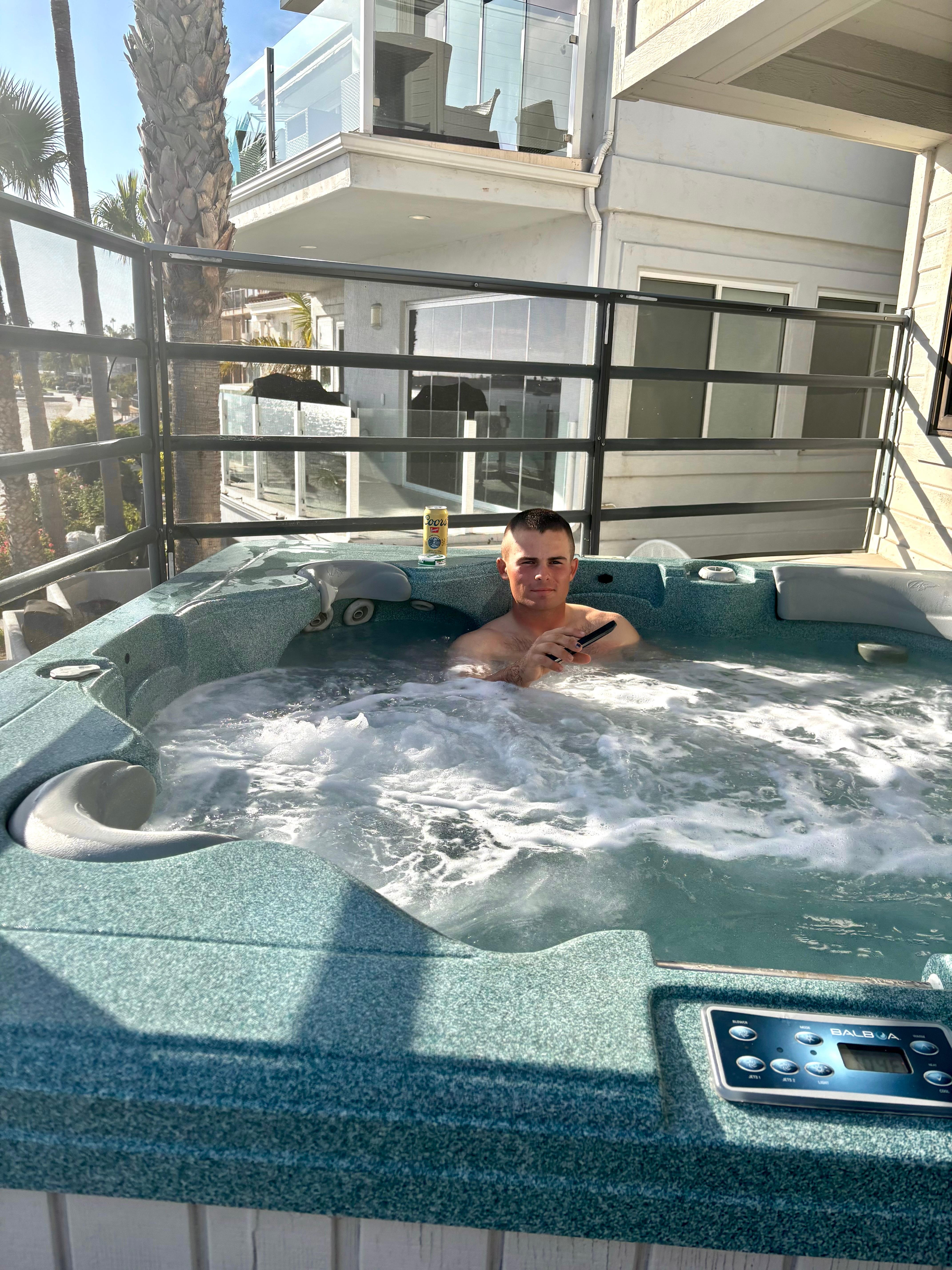 Our new marine, relaxing after graduation, in the hot tub!