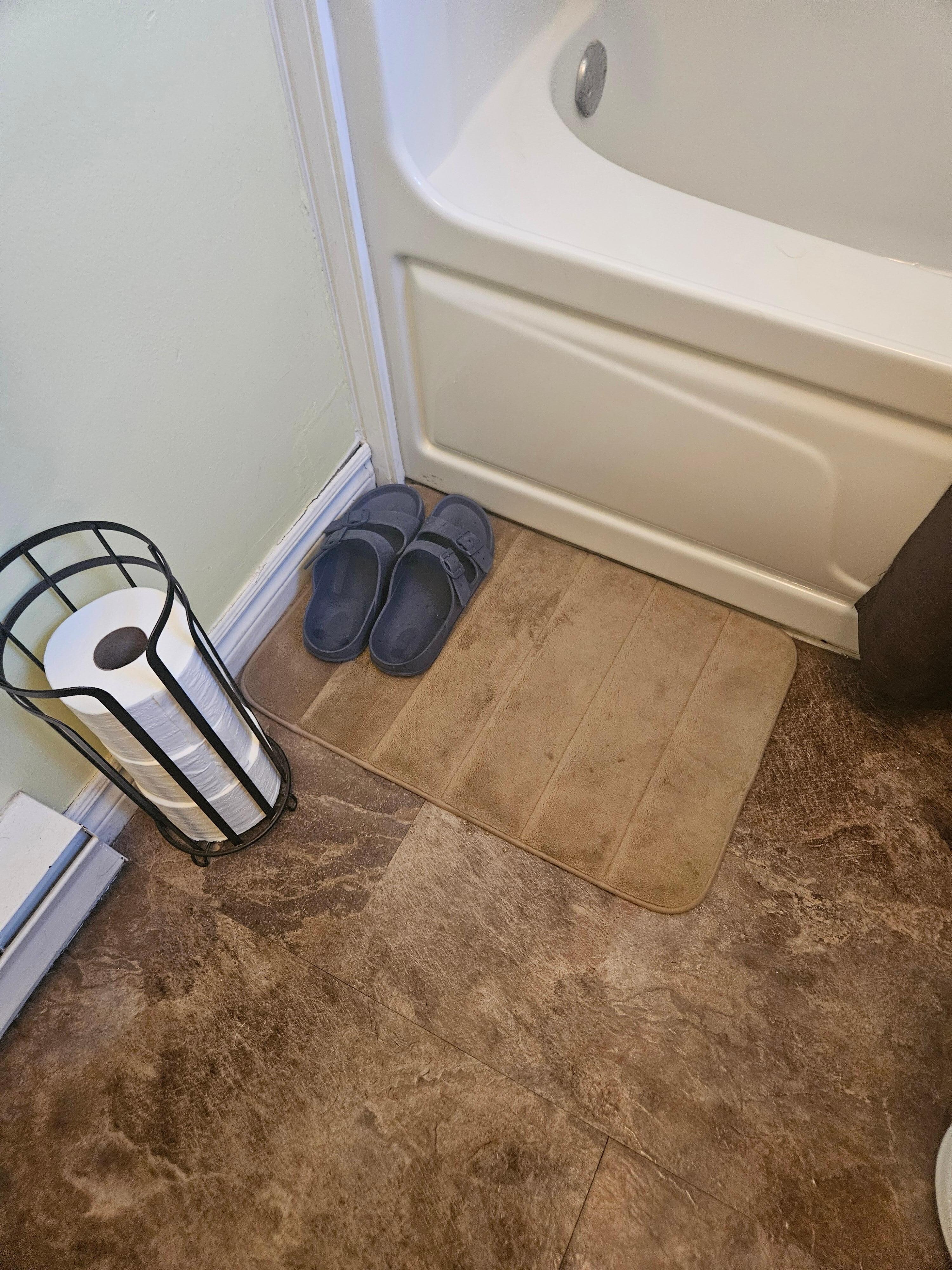 These weren't our sandals by the tub. Also, there was someone's personal bar of soap in the tub area.