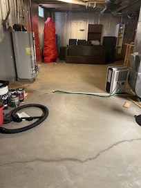 This is the exercise room. Stationary bike with hunting clothes hanging off it.