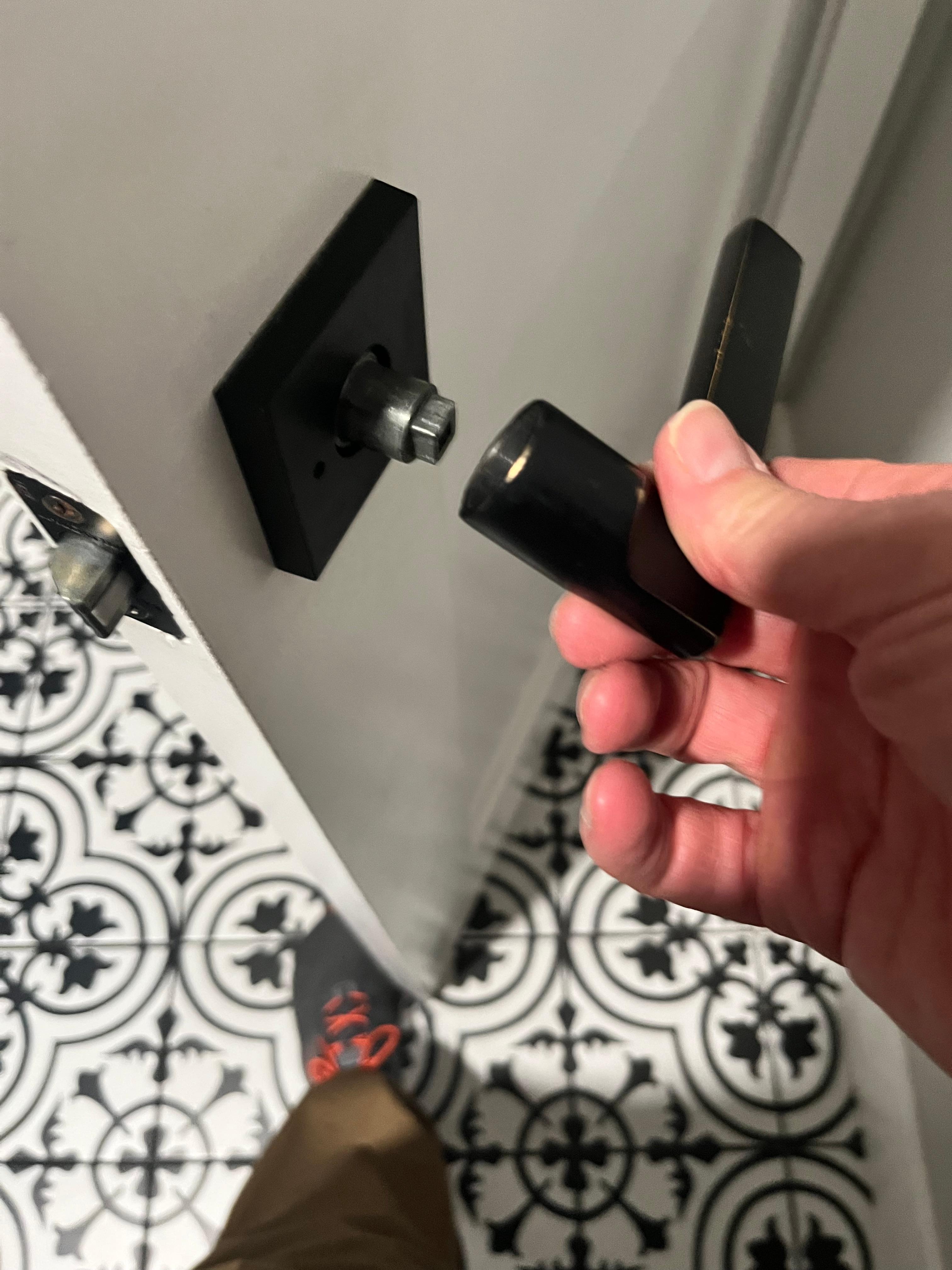 Door handle on inside laundry room door was not attached properly