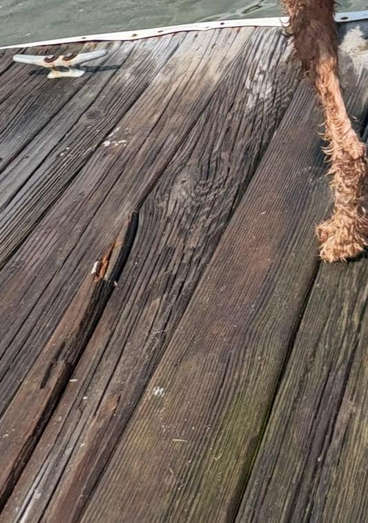 Close up of some of the rotting boards- most evident when wet. 