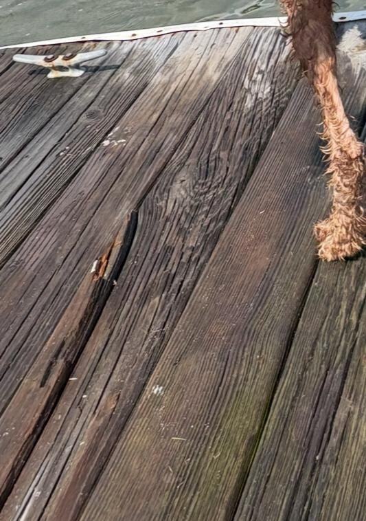 Close up of some of the rotting boards- most evident when wet. 