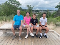 My wife and I with the two grandsonâs at New Buffalo Beach