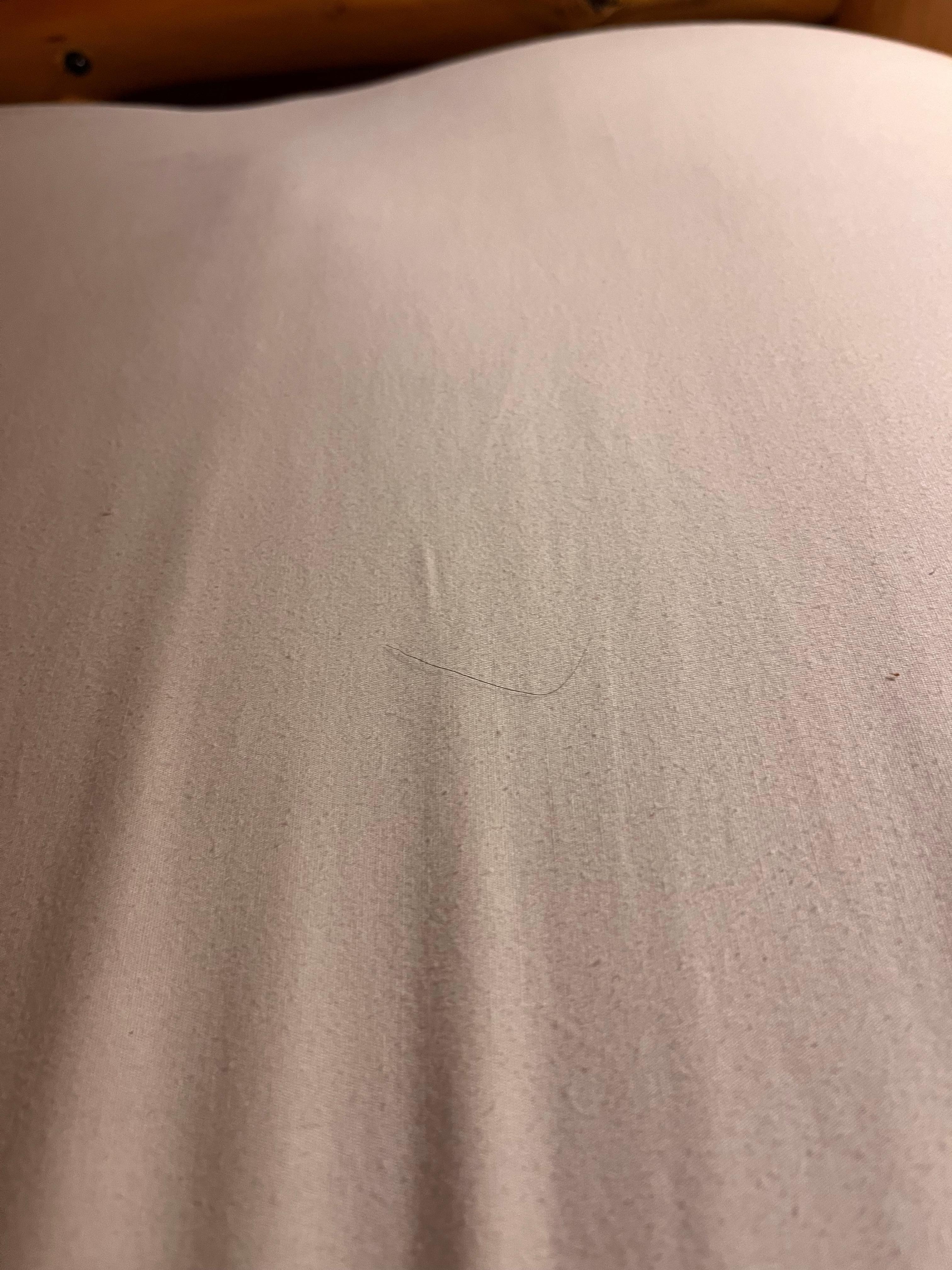Long black hairs. Not mine on sheets and pillows. One pillow smelled like perfume.