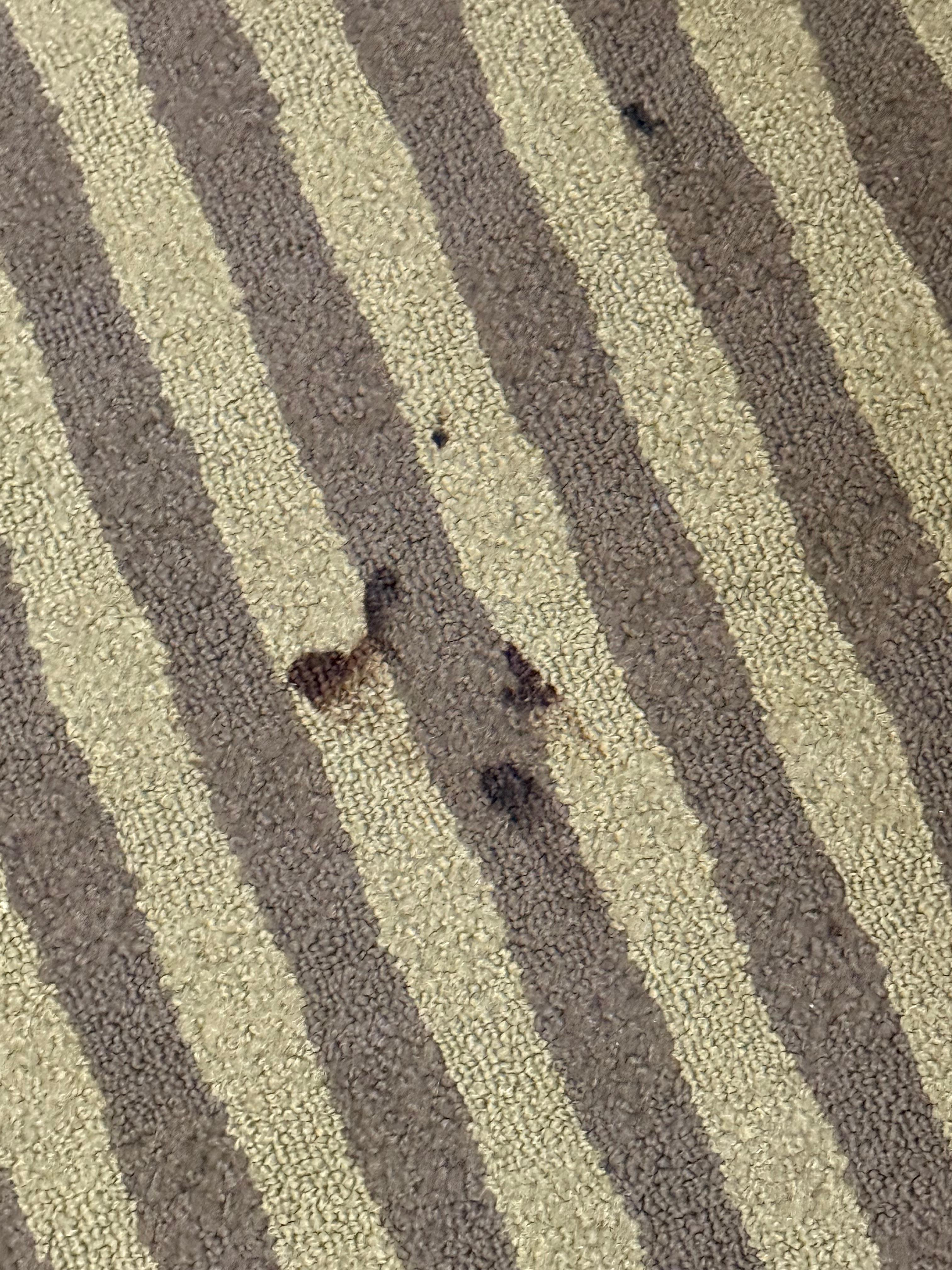The carpet in front of the sink
