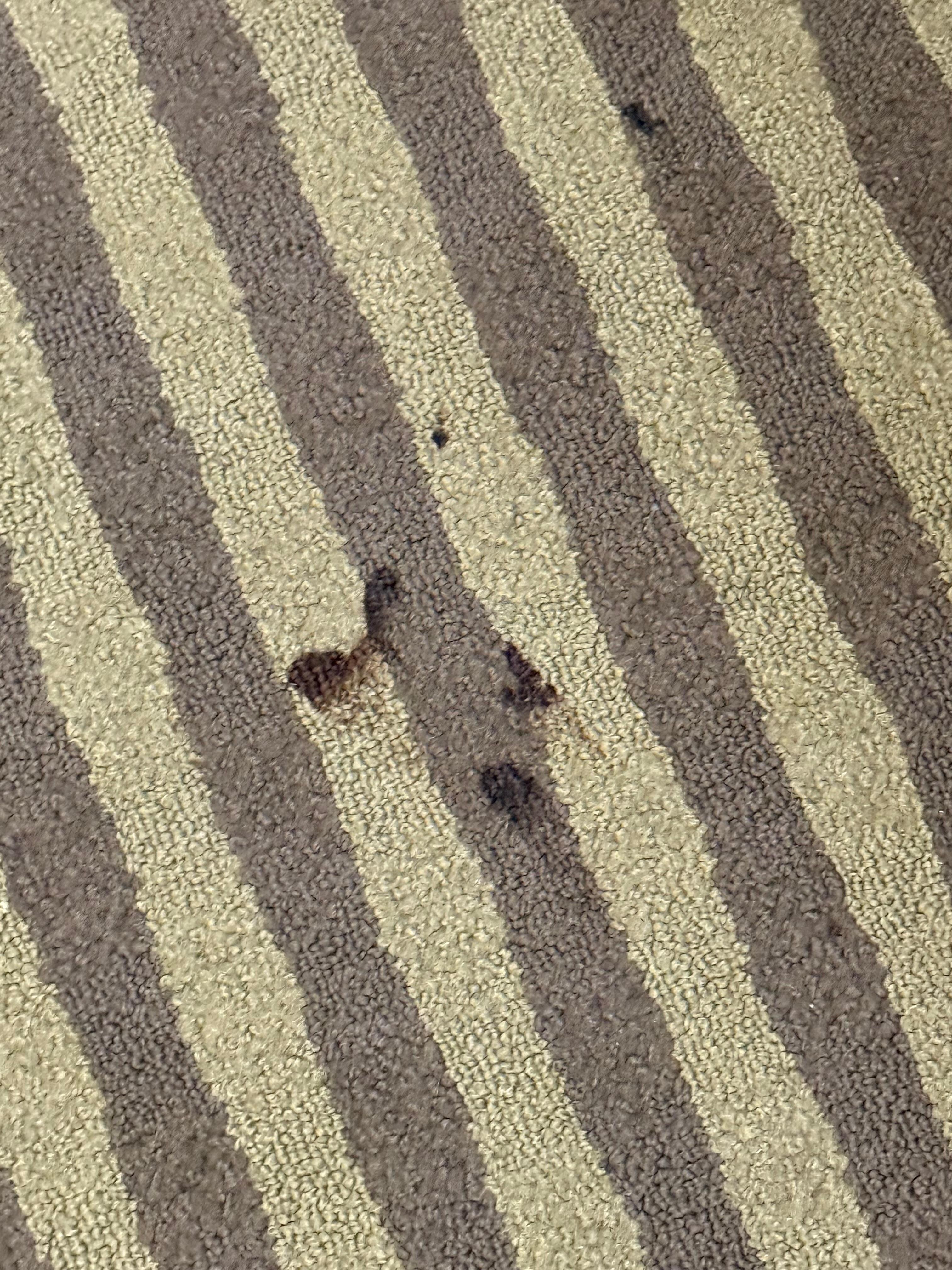 The carpet in front of the sink
