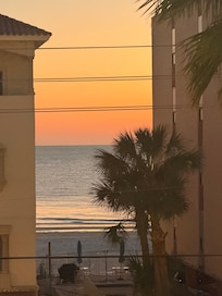 Sunset from right outside our front door (between some buildings across the street)