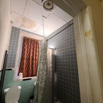 Tiles in ceiling showed water damage.