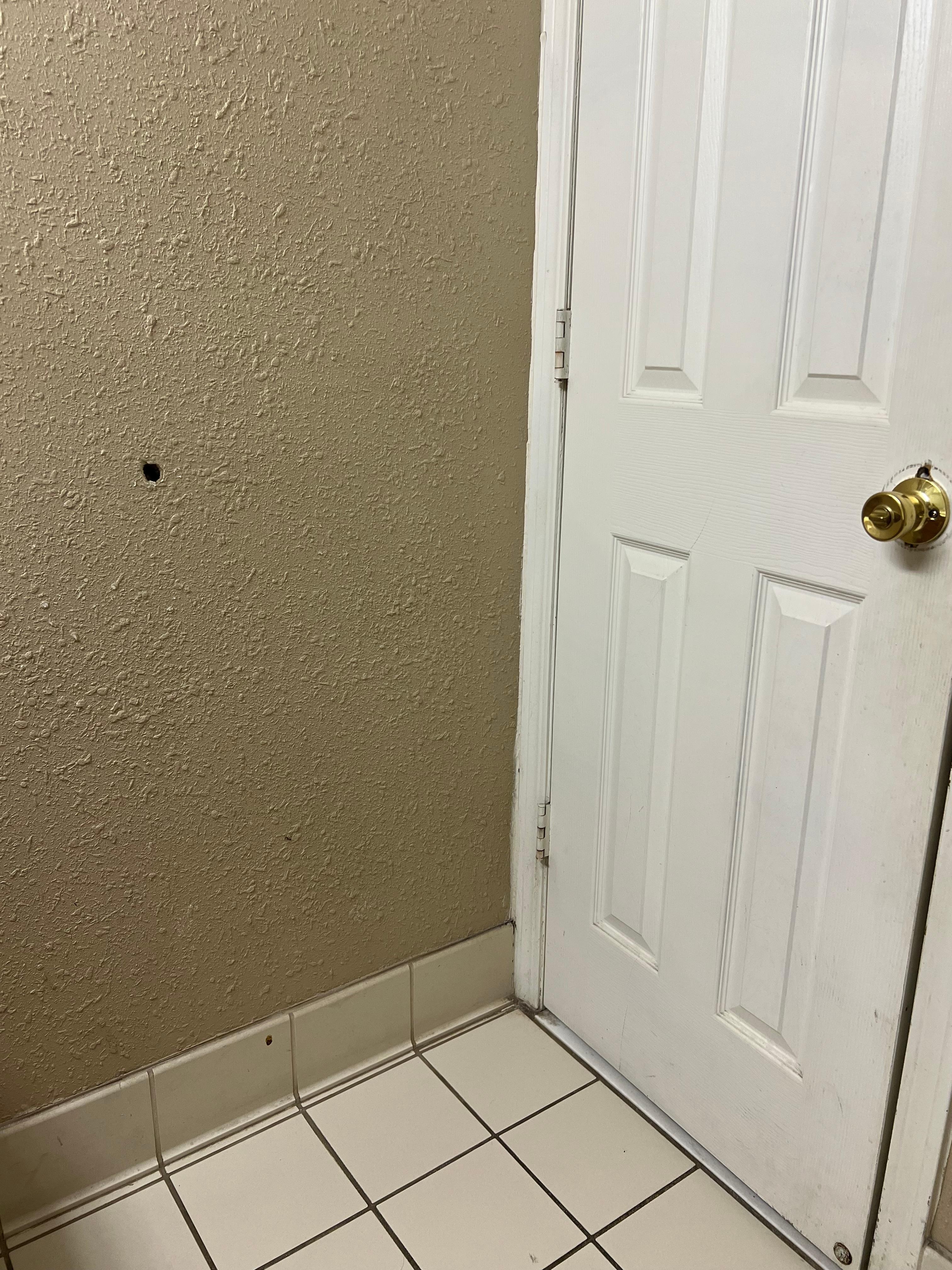 Holes in the bathroom wall