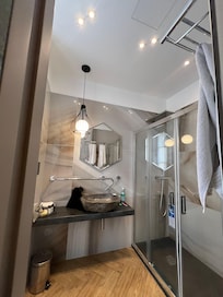 The bathroom through the left, mirrored door