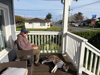 Enjoying the sunshine on the front porch of the VRBO.