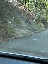 The pot hole at the end of the driveway.