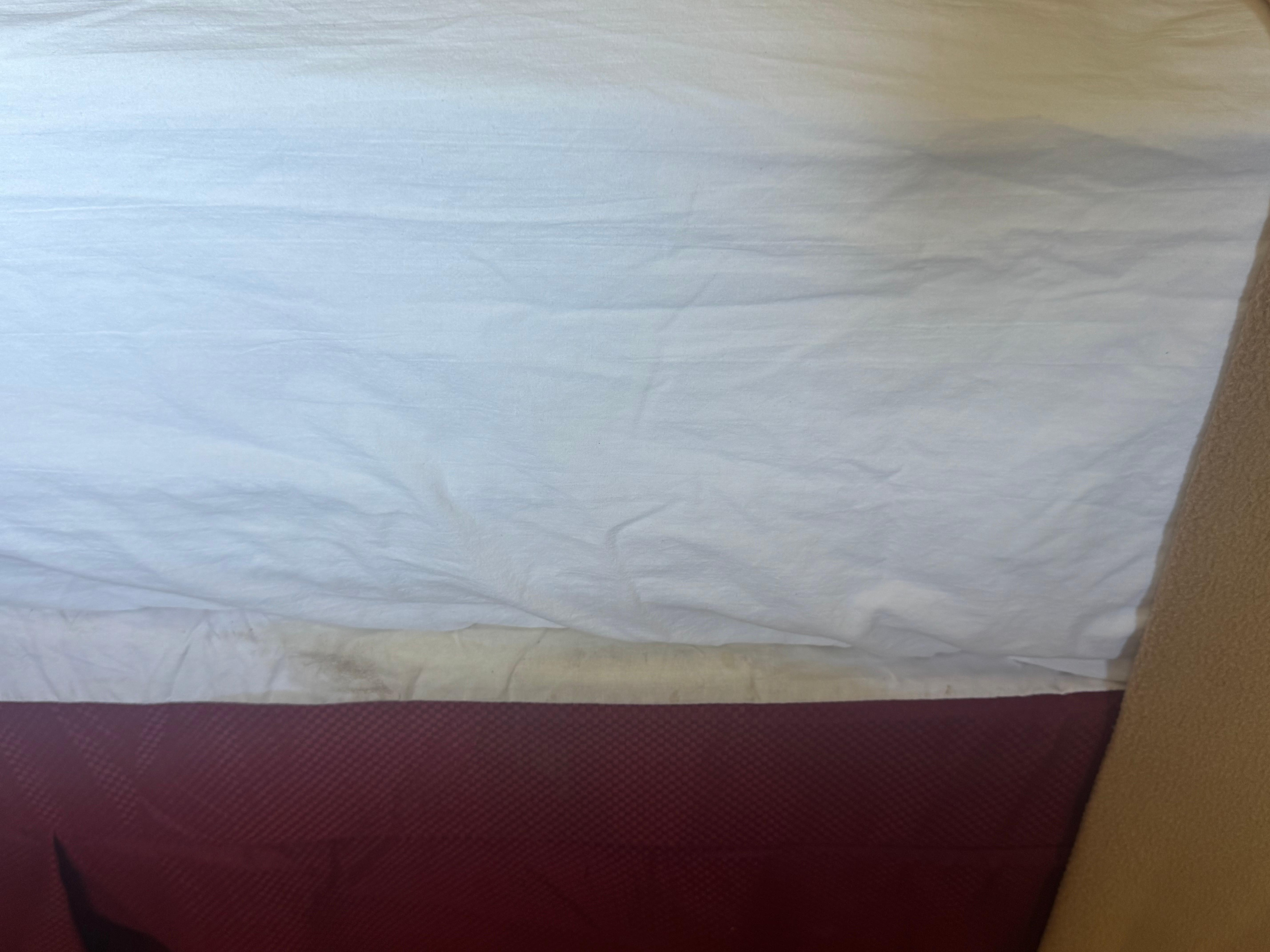 Yellow stains on the covers and bed