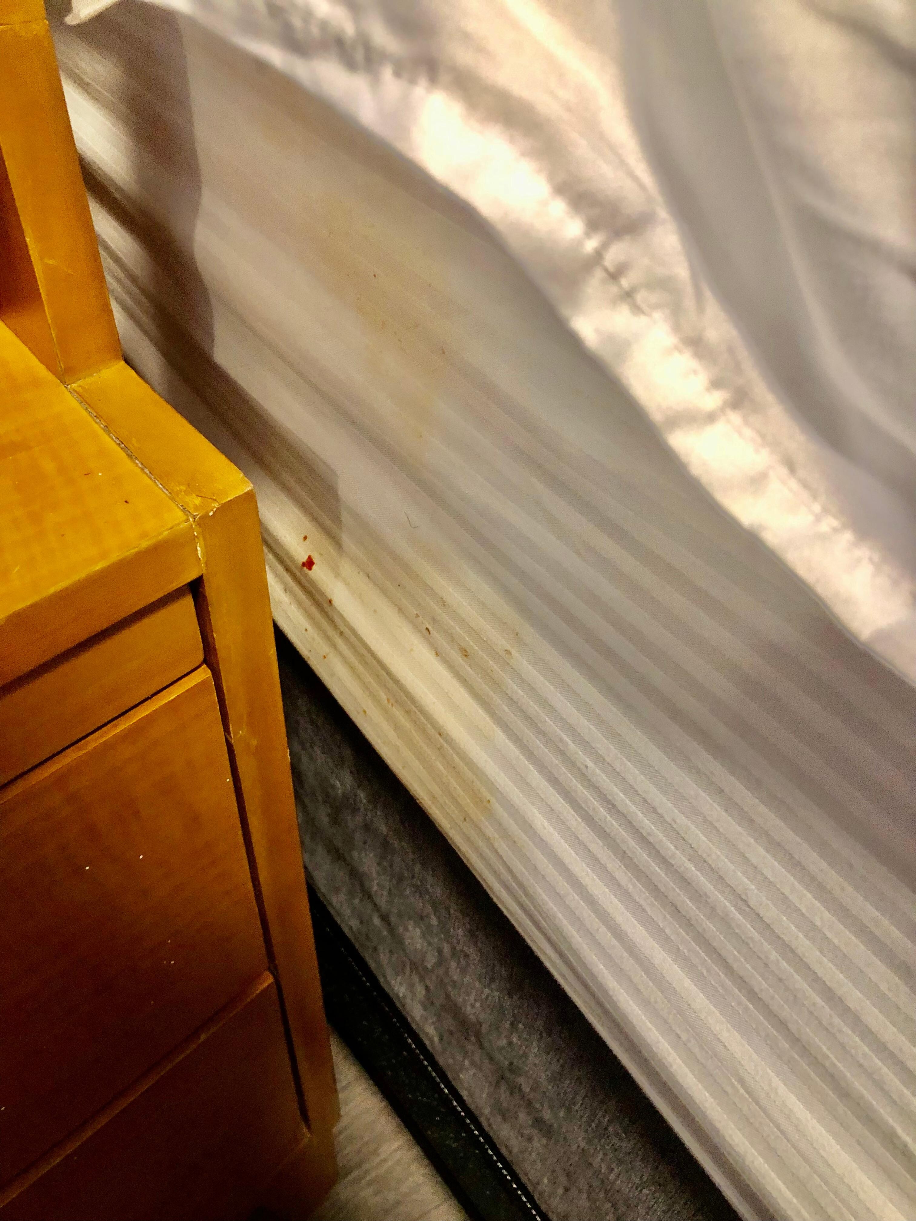 Very stained sheets with what looked like food still on it