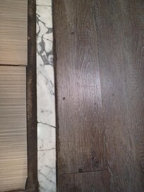 Flaking black grout.