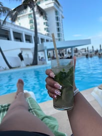 Relaxing with a mojito by the pool!